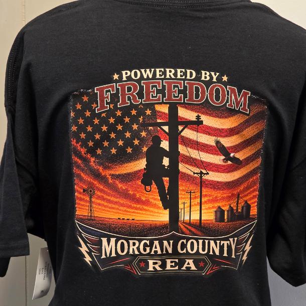 Completed black Morgan County REA shirt with a large Powered by Freedom full-color back design