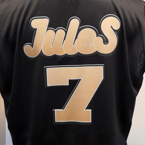 Completed black team-style shirt with a custom gold Jules 7 back graphic