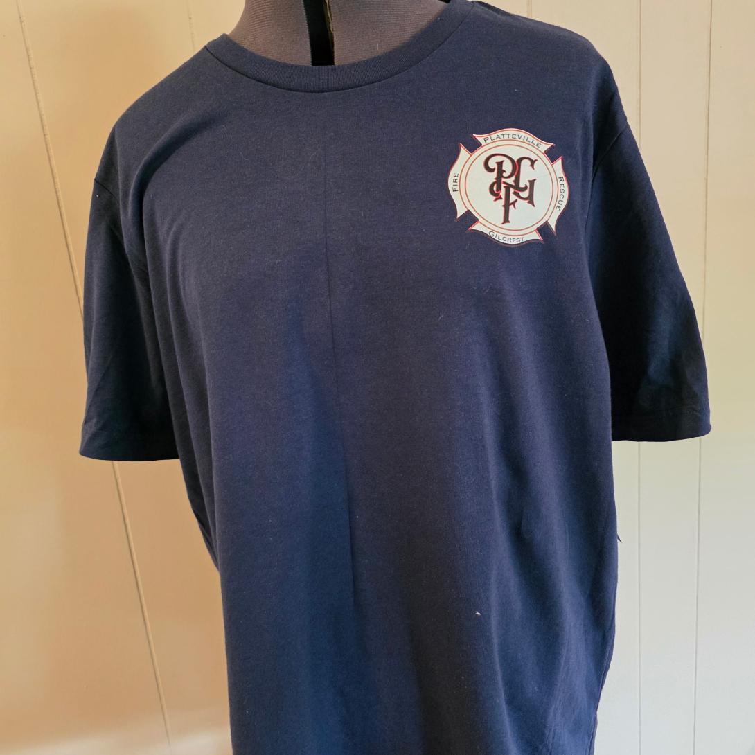Completed navy Platteville-Gilcrest Fire Rescue shirt with a decorated front logo