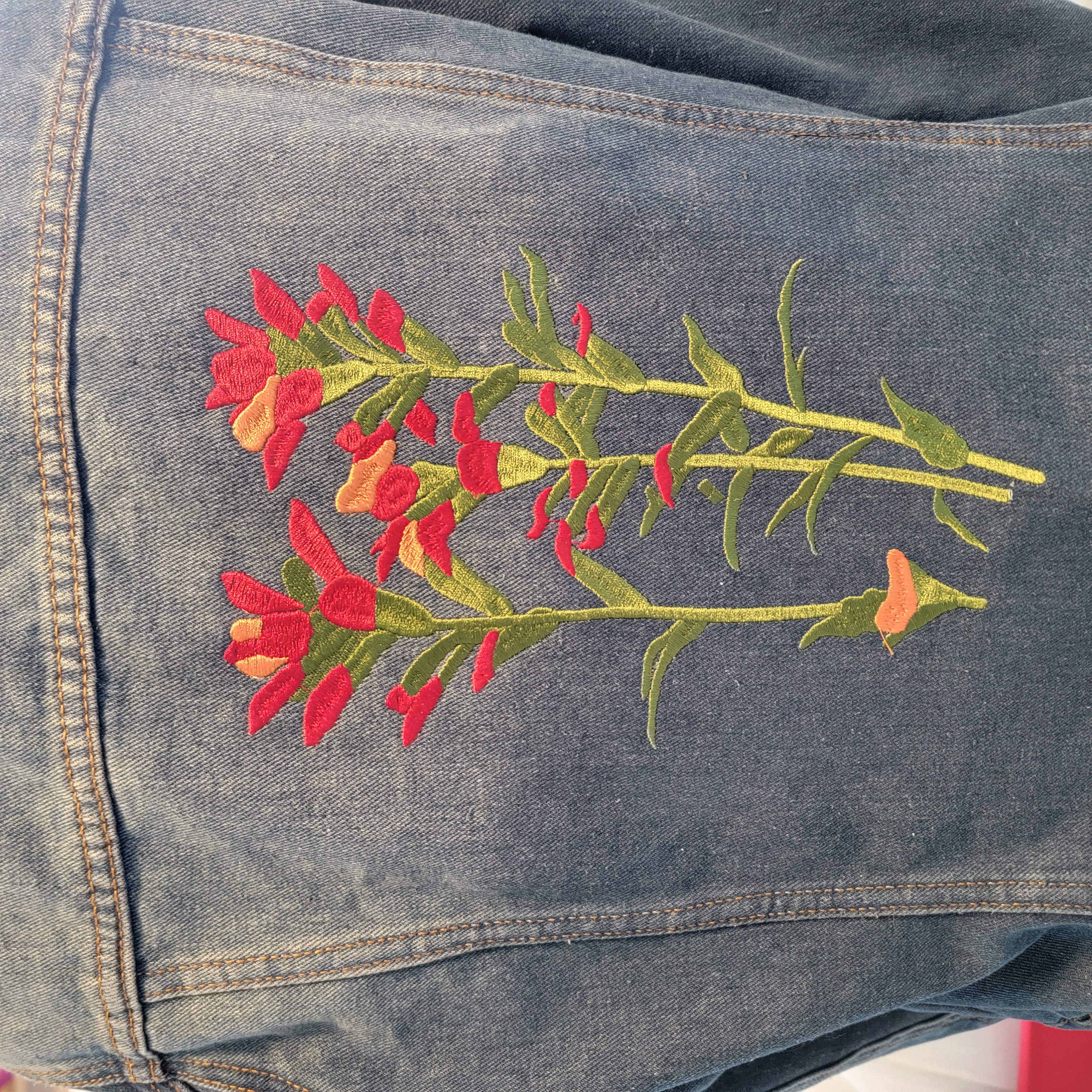 Completed denim jacket with multicolor floral embroidery